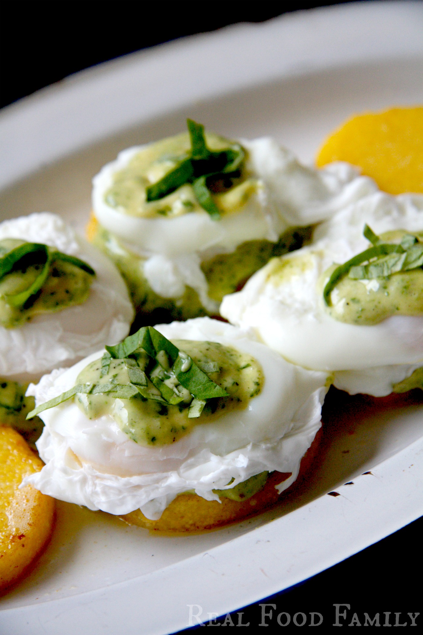 Gluten Free Eggs Benedict on Polenta Cakes with Pesto Hollandaise